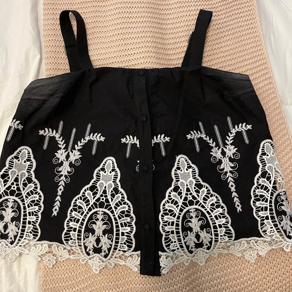 black blouse with white detailing